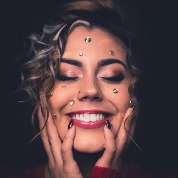 Avery Singh, Lead Design Curator at ShoreVioletClover, reviewing corporate floral arrangements